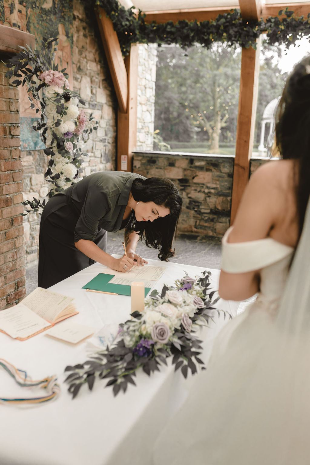 A solemniser signing the marriage register